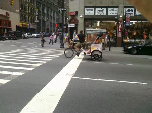 A Marc Jacobs' Daisy pedicab rolls uptown